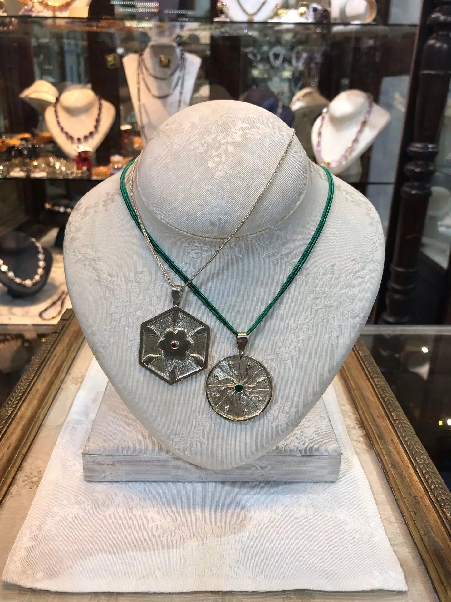 Pendant in Sterling Silver and 14k Gold with a green round stone