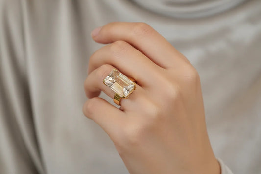 Ring in 18k Gold with a faceted rutile quartz stone (B-56)