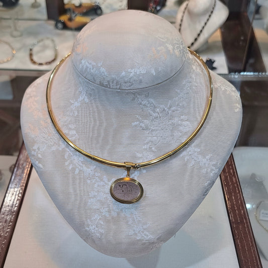 Necklace in 14k gold with a seal stone on a chalcedony