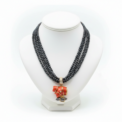Necklace in Black Tahitian Pearls with sterling silver elements and a Coral Pendant with brilliants and 18k elements