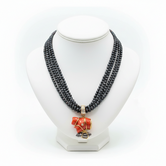 Necklace in Black Tahitian Pearls with sterling silver elements and a Coral Pendant with brilliants and 18k elements