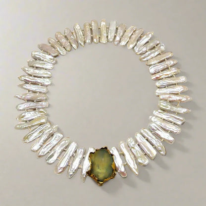 Necklace with baroque pearls and 14k gold close with an aquamarine cabochon stone - Dinos-Virginia
