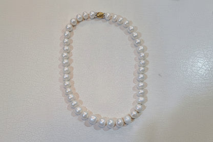 Necklace with potato shape pearls with 18k gold closure, one of a kind closure