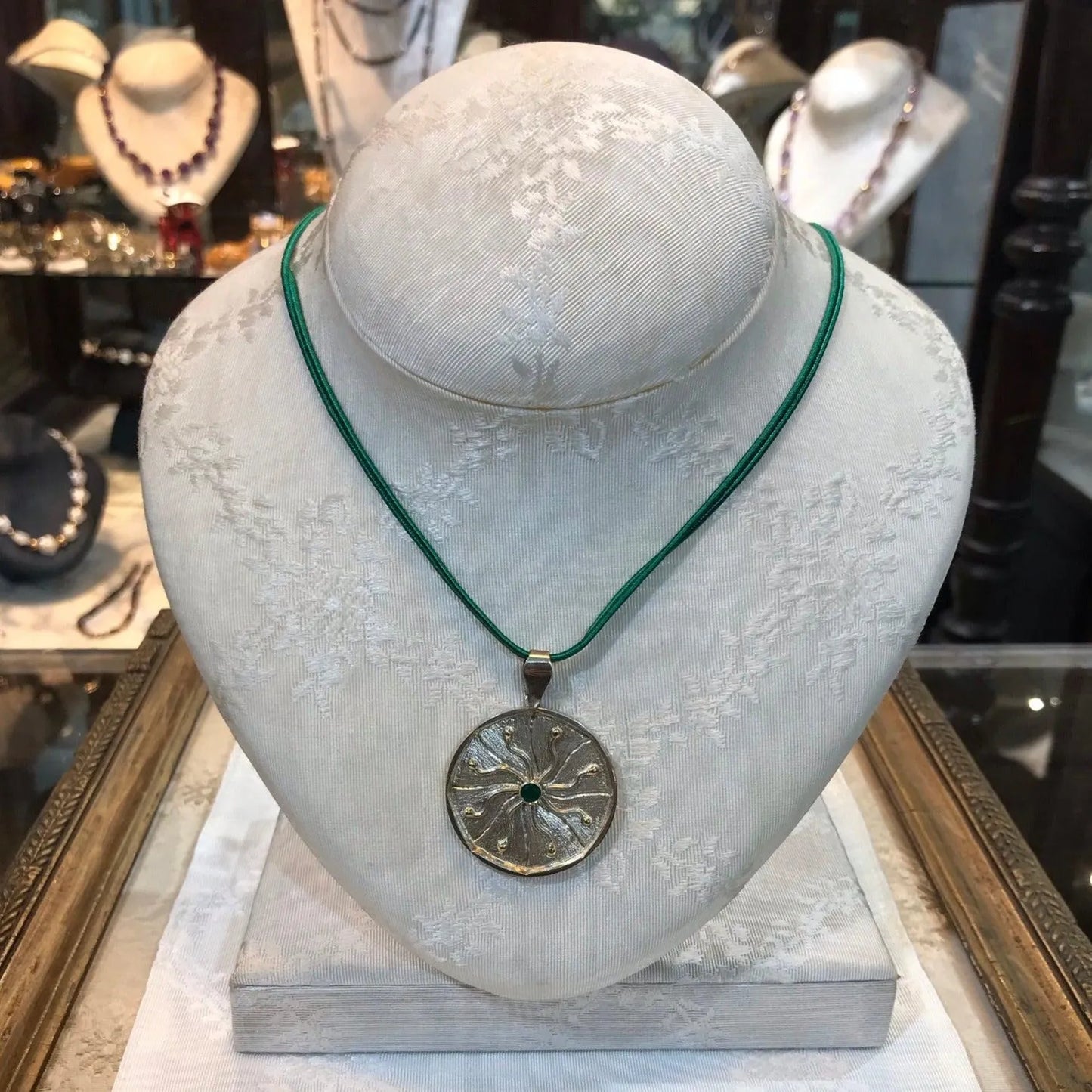 Pendant in Sterling Silver and 14k Gold with a green round stone