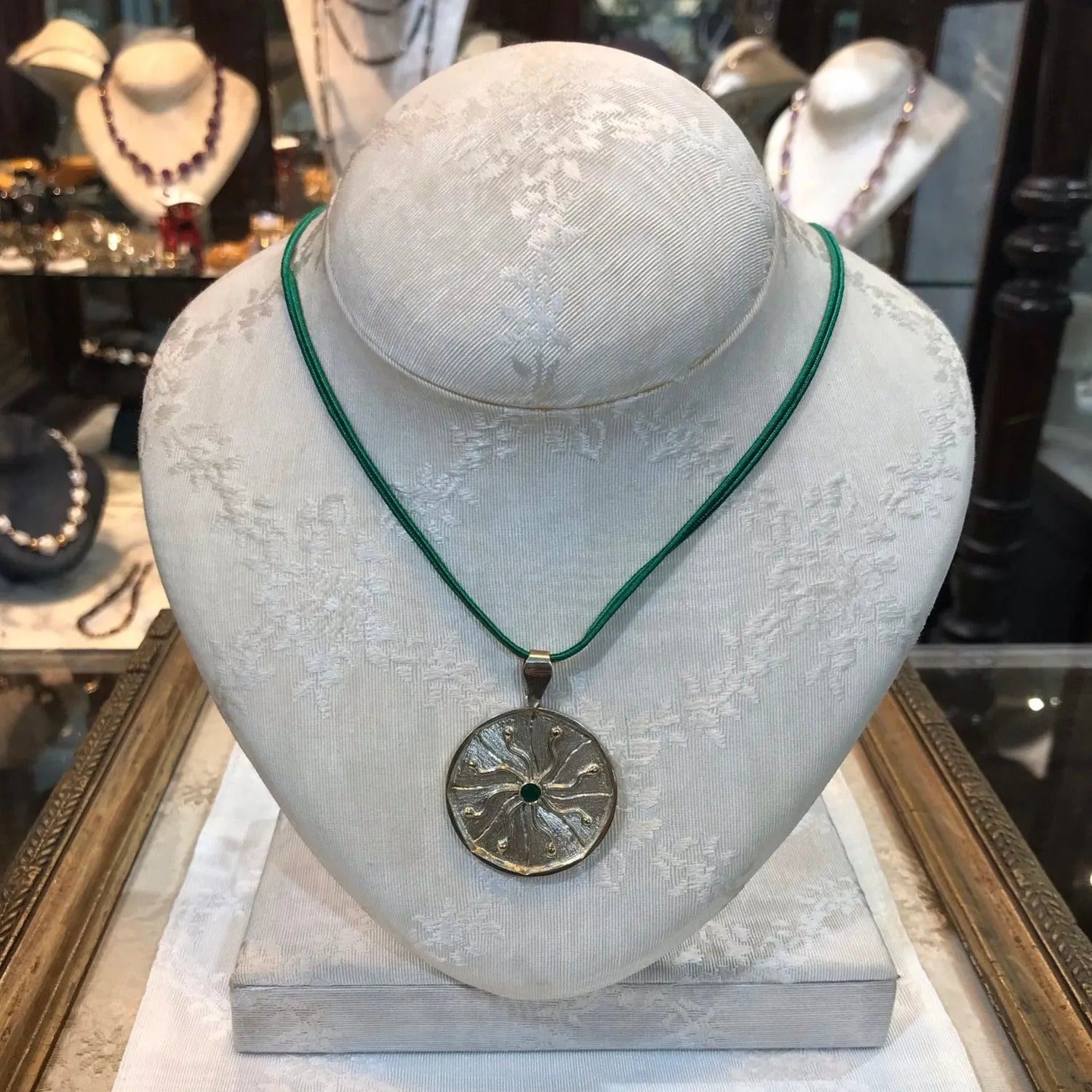 Pendant in Sterling Silver and 14k Gold with a green round stone