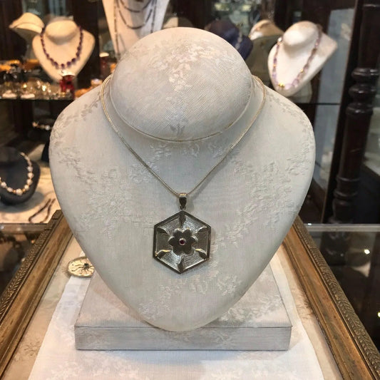 Pendant in Sterling Silver and 14k Gold with a round ruby stone