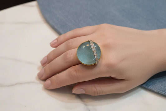 Ring in 18k Gold with a 50 ct. aqua marin cabochon and diamonds (B-16)