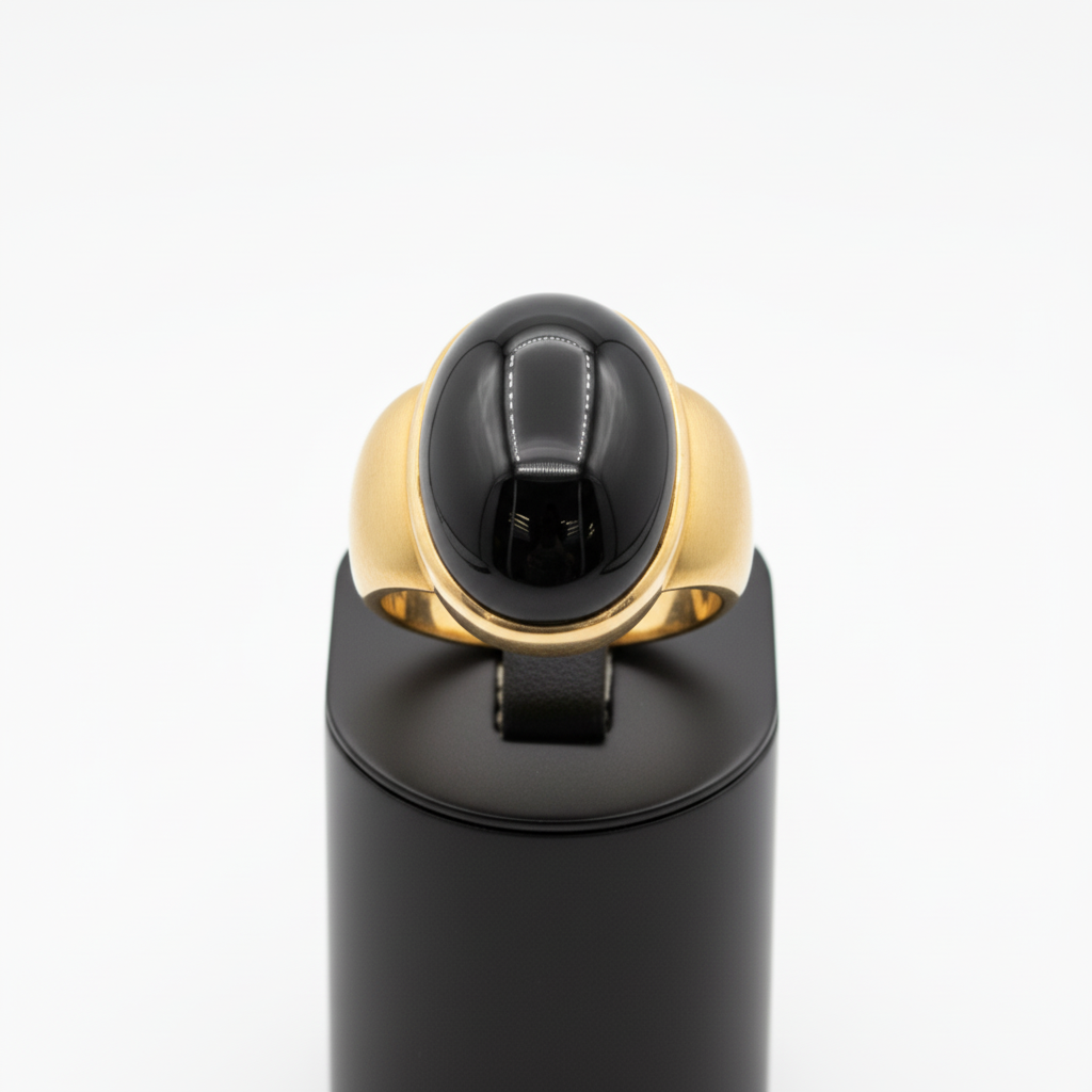 Black and gold ring on a white background